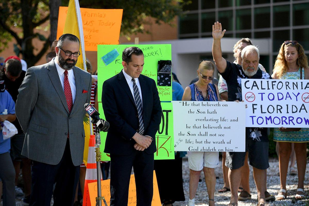 State Rep. Anthony Sabatini leads an anti-mask rally with Rev. Joel Tillis at the Manatee County Courthouse Monday morning along with about 100 people.