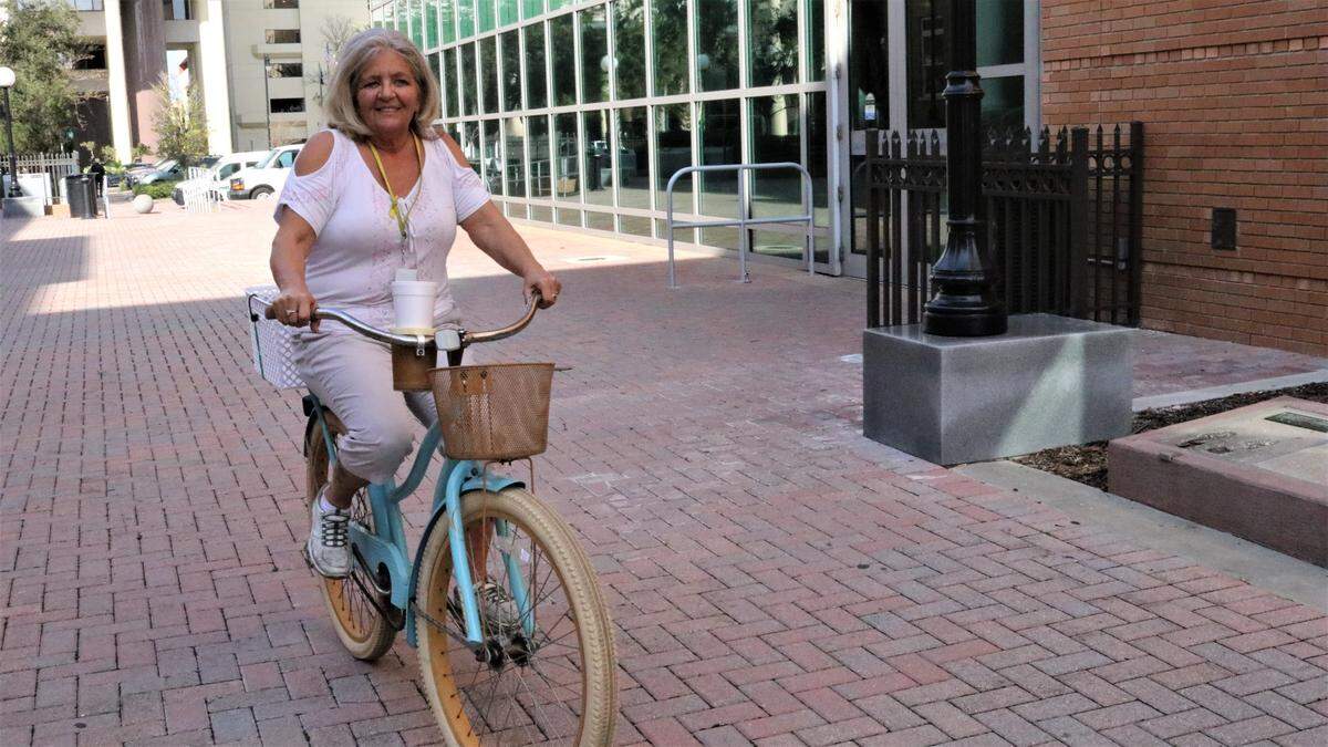 Kelly McLane delivers food by bike to the downtown area for Bandit’s Cafe. The restaurant is located on the ground floor of the Manatee County Judicial Center, 1051 Manatee Ave. W.