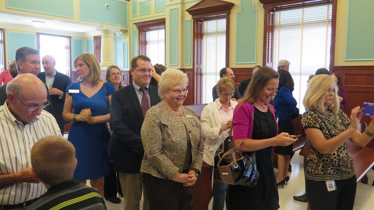A line of people wait to congratulate Angelina "Angel" Colonneso Friday. Colonneso was sworn in as the Manatee County Clerk of the Circuit Court.AMARIS CASTILLO/Bradenton Herald