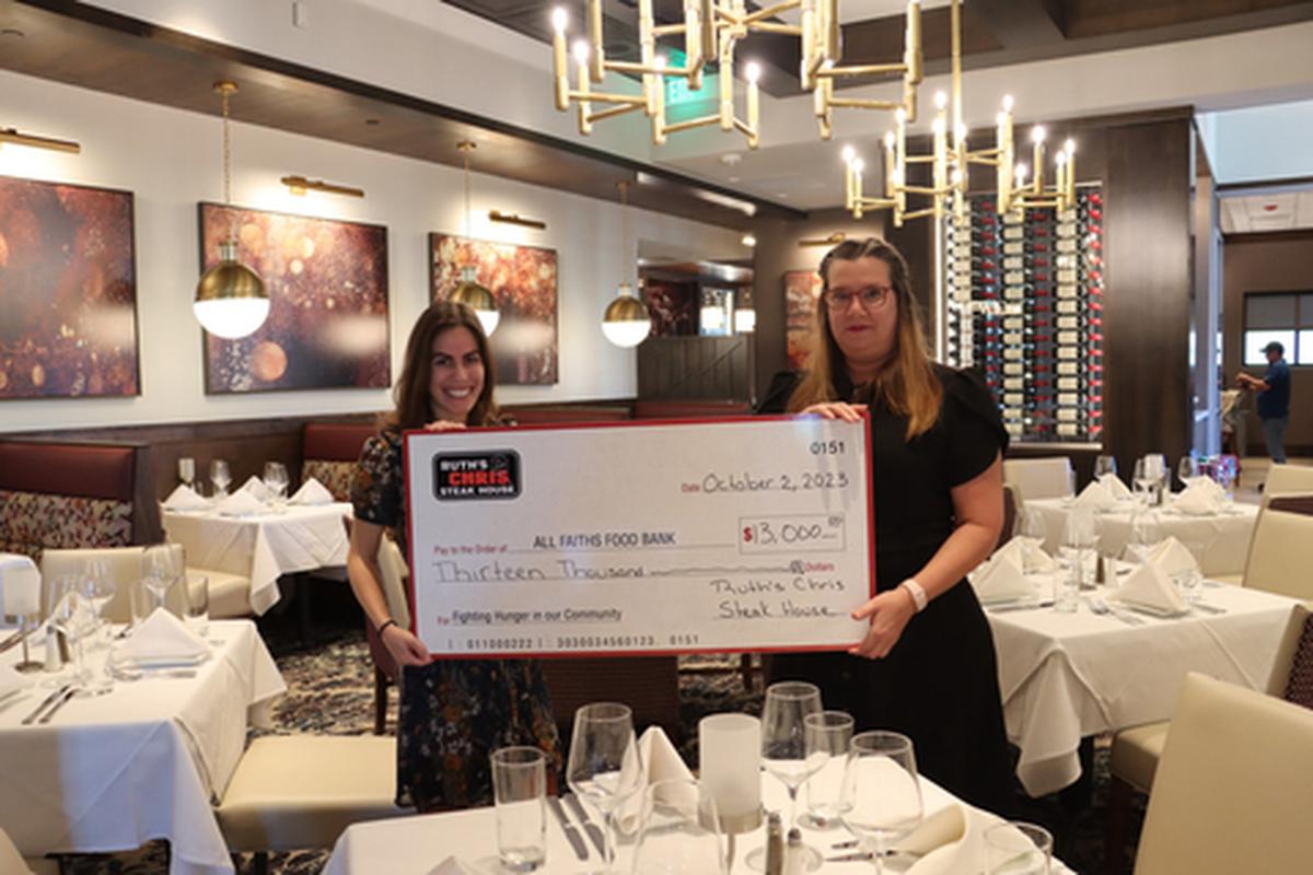 As part of the pre-opening of the new Ruth’s Chris Steakhouse at Lakewood Ranch, the restaurant hosted a dinner with community leaders, business owners and Ruth’s Chris executives to raise money for All Faiths Food Bank. Pictured are Ruth’s Chris Steak House Lakewood Ranch general manager Tanya Kutchara and All Faiths Food Bank manager of donor stewardship Victoria Hasselbring.