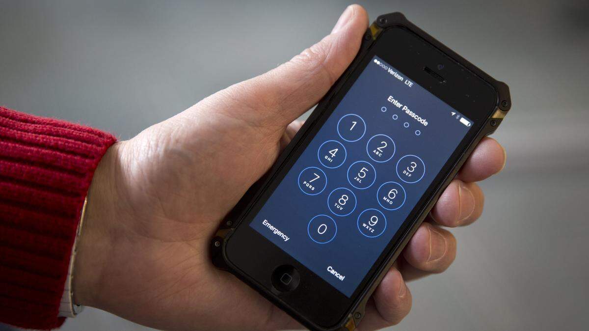 FILE - In this Feb. 17, 2016 file photo, an iPhone is seen in Washington. The FBIís announcement that it mysteriously hacked into an iPhone is a setback for Apple and increases pressure on the technology company to restore the security of its flagship product. (AP Photo/Carolyn Kaster, File)