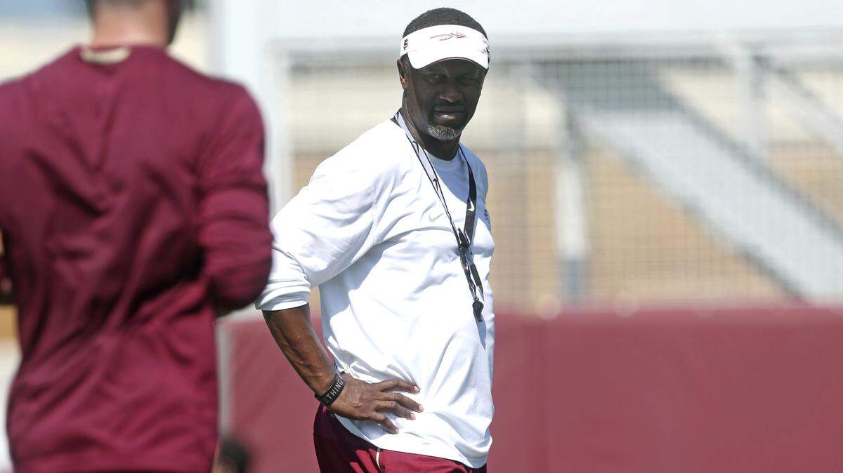 Florida State coach Willie Taggart watches his team work out.