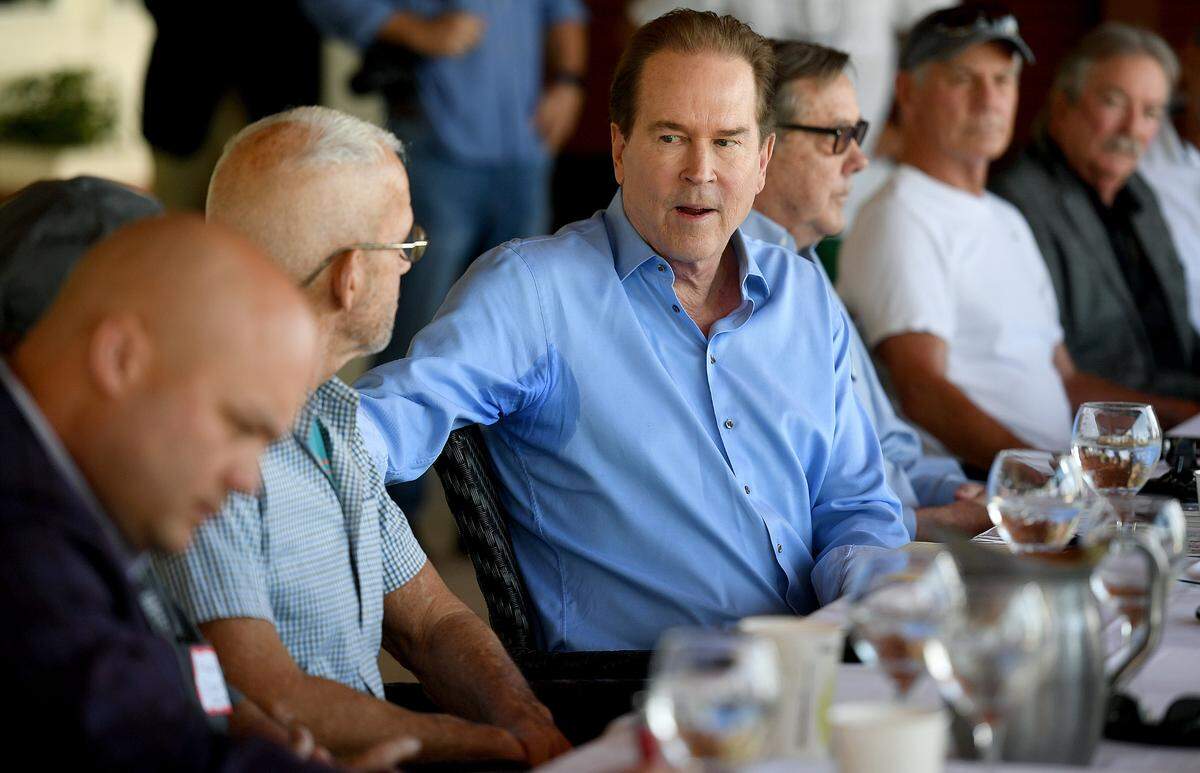 U.S. Congressman Vern Buchanan (R) participates in a roundtable discussion on increased levels of red tide in the Southwest Florida at the Beach House Restaurant in Bradenton Beach Friday.