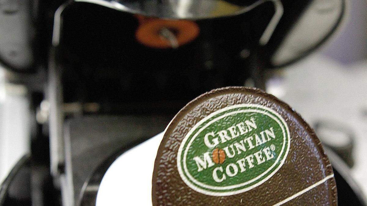 FILE - In this Oct. 7, 2010, file photo, a Green Mountain Coffee single-serving brewing cup is seen in a Keurig machine in Montpelier, Vt. Keurig, the single-cup coffee machine maker, said Monday, Dec. 7, 2015, that it has agreed to be sold to private equity firm JAB Holding Co. for almost $14 billion. (AP Photo/Toby Talbot, File)