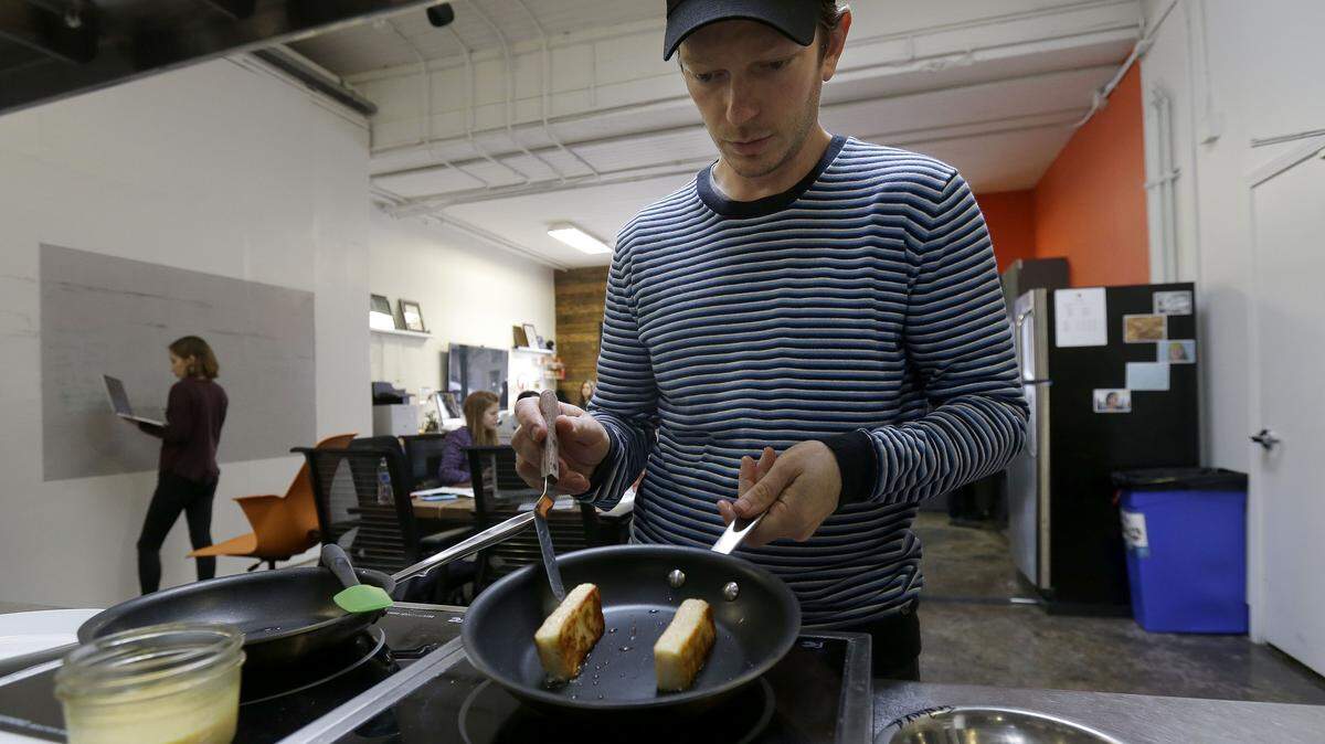 Hampton Creek Foods pastry chef Ben Roche preparing french toast made with Just Scramble at their office in San Francisco last February. Hampton Creek's mission is to replace the eggs in products without anyone noticing. 
 AP Photos/JEFF CHIU