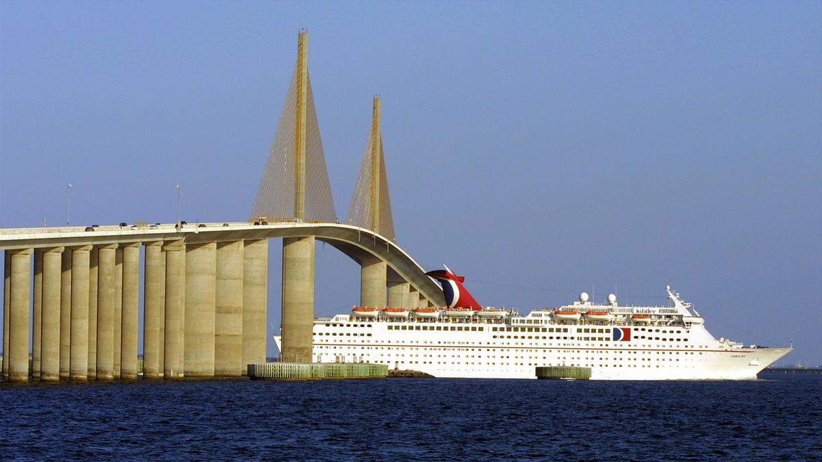 Carnival Cruise ship the HS Jubilee passes under the Skyway Bridge in late afternoon from the North Pier in 2002.