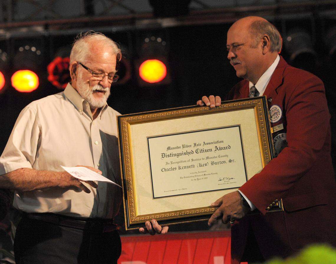 Ken Burton Sr. receives the Manatee River Fair Association's 2013 Distinguished Citizen Award presented by Dan Molter, fair president, during a VIP luncheon.