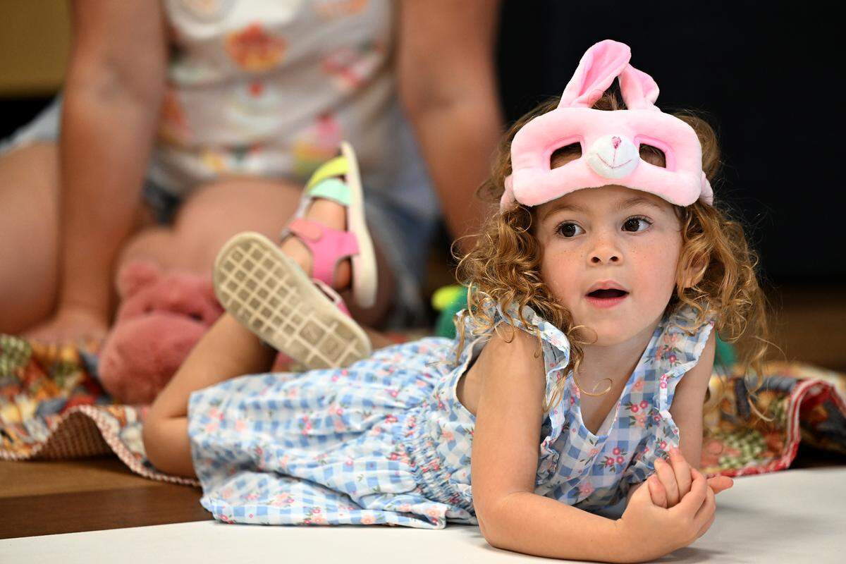 Carolina Heredia is enraptured during story time at the Soar Lab, which recently opened in Manatee County's Sara Scott Harllee Center. They provide families with hands-on learning experiences that are tied to early development learning standards shown on Friday, Oct. 17, 2025.
