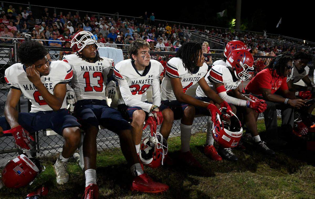 Manatee High players watch the action in Venice on Friday, Oct. 6, 2023.