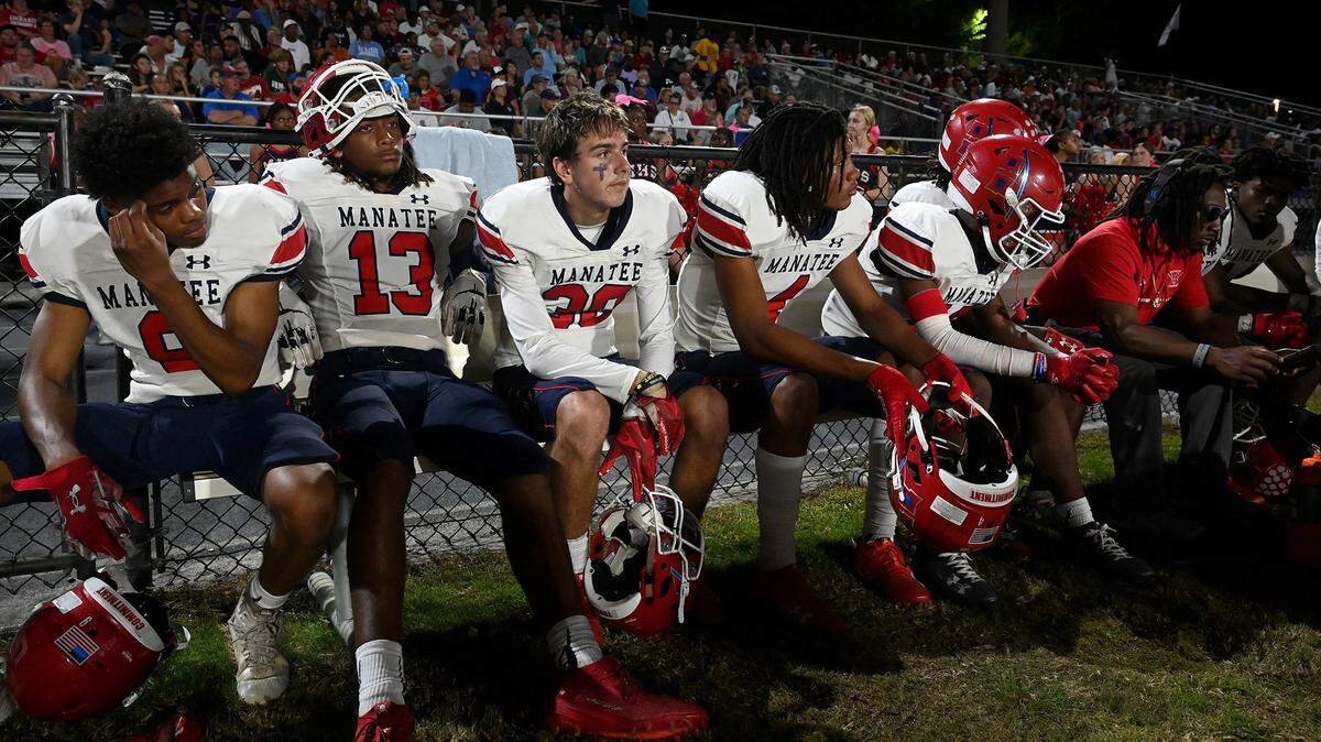 Manatee High players watch the action in Venice on Friday, Oct. 6, 2023.