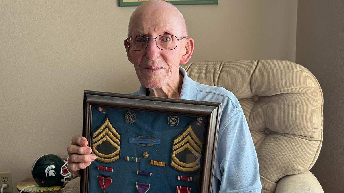 John V. Skeen, a 105-year-old Bradenton resident and World War II combat veteran, shows a display of his World War II awards. He is the grand marshal for the 2023 Manatee County Veterans Day parade.