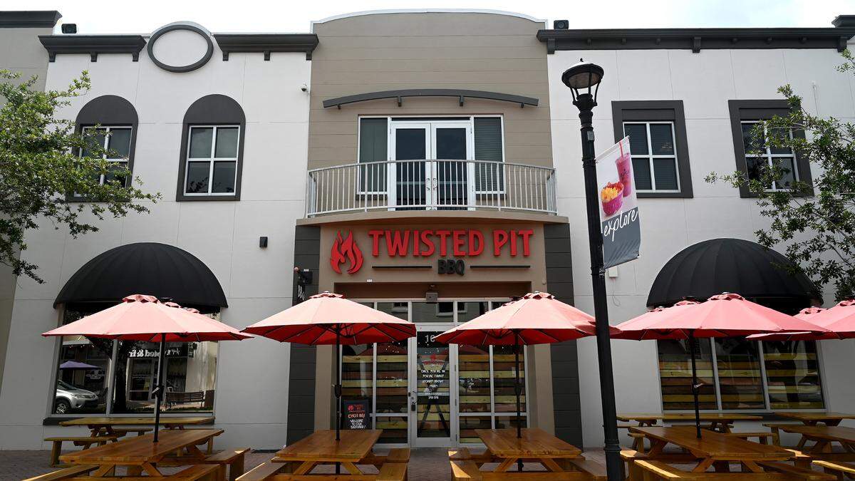 The exterior has picnic benches for outdoor dining at the Twisted Pit BBQ on Main Street in Lakewood Ranch.