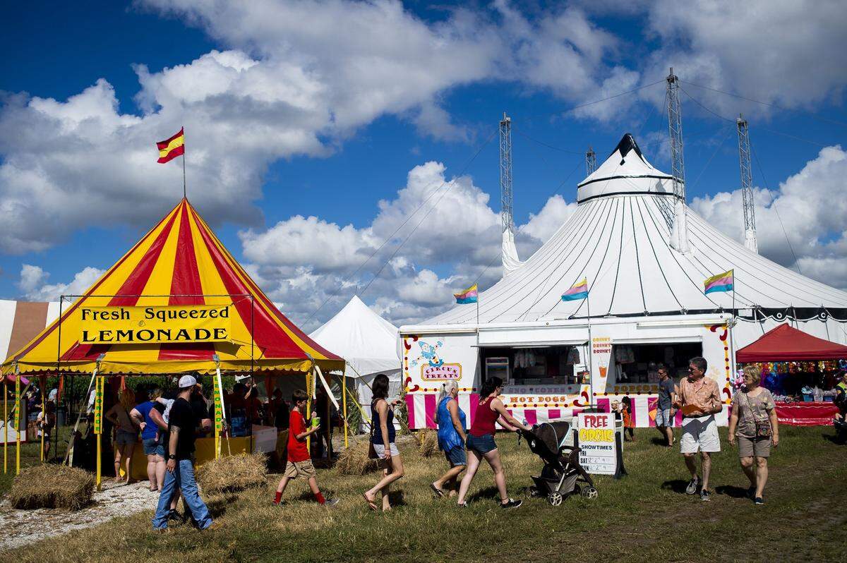 Festival-goers browse shops and activities during the Hunsader Farms 26th Annual Pumpkin Festival in east Bradenton. The 27th Annual  Pumpkin Festival kicks off this Saturday.