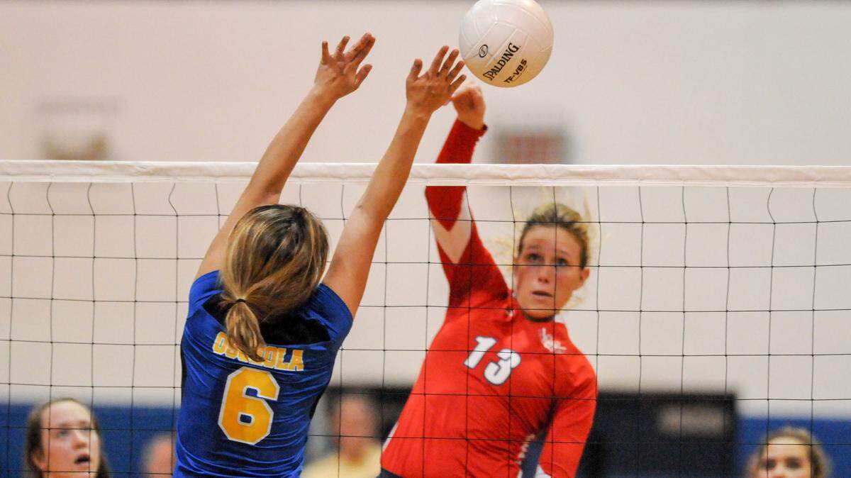 Jacqui Armer, right, is one of four Manatee volleyball players on the 2015 All-Area Team.