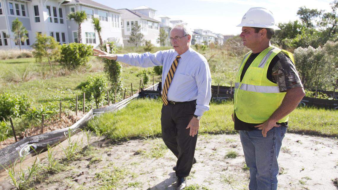 Pat Neal, chairman of Neal Communities, looks over preparations being made to install storm sewer pipes at his Harbor Sound development. Mitch Lloyd, a superintendent with E.T. MacKenzie of Floriday, supervises the work. MATT M. JOHNSON/Bradenton Herald