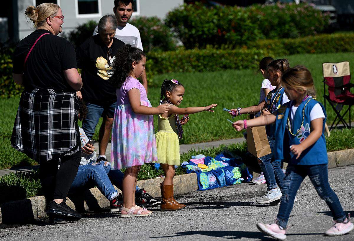 Beads and treats are a favorite at the Hernando De Soto Historical Society’s Children’s Parade in Palmetto on March 29, 2024.