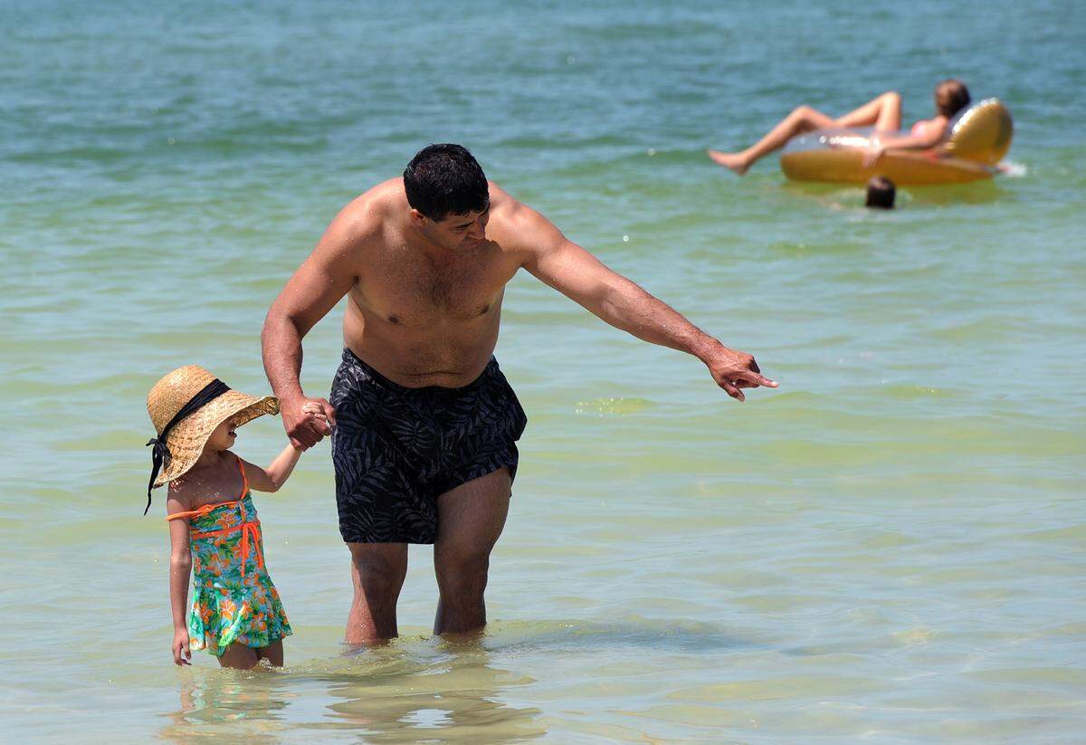 Enrique Rivera and daughter, Lexee, 4, play in the water at Coquina Beach on Anna Maria Island in this file photo. TIFFANY TOMPKINS-CONDIE/Bradenton Herald