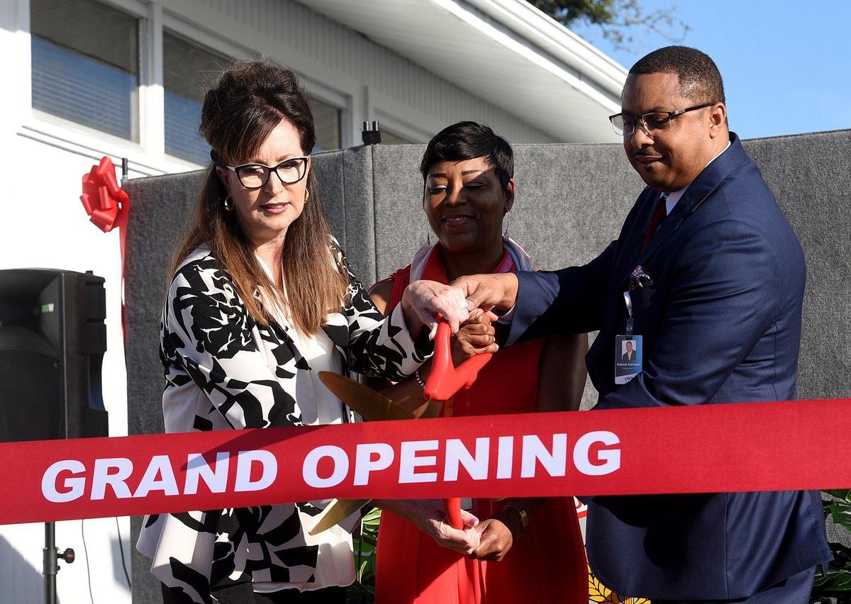Patrick Carnegie cut the ribbon on a new School based health center at Southeast High which offers medical, dental, and vision services. Also shown in this file photo from 2020 are school district Superintendent Cynthia Saunders and principal Rosa Faison and