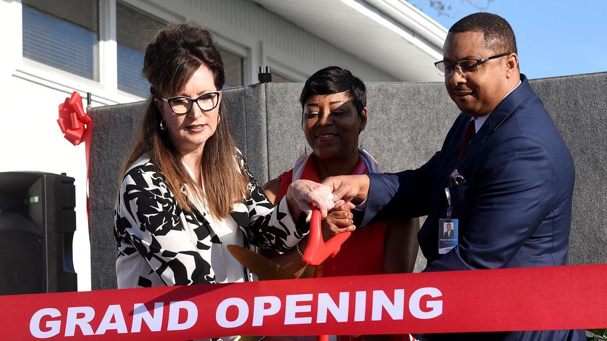 Patrick Carnegie cut the ribbon on a new School based health center at Southeast High which offers medical, dental, and vision services. Also shown in this file photo from 2020 are school district Superintendent Cynthia Saunders and principal Rosa Faison and