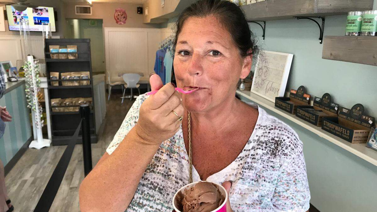 Elayne Armaniaco samples the chocolate ice cream at Island Scoops, 103B Gulf Drive North, Bradenton Beach.
