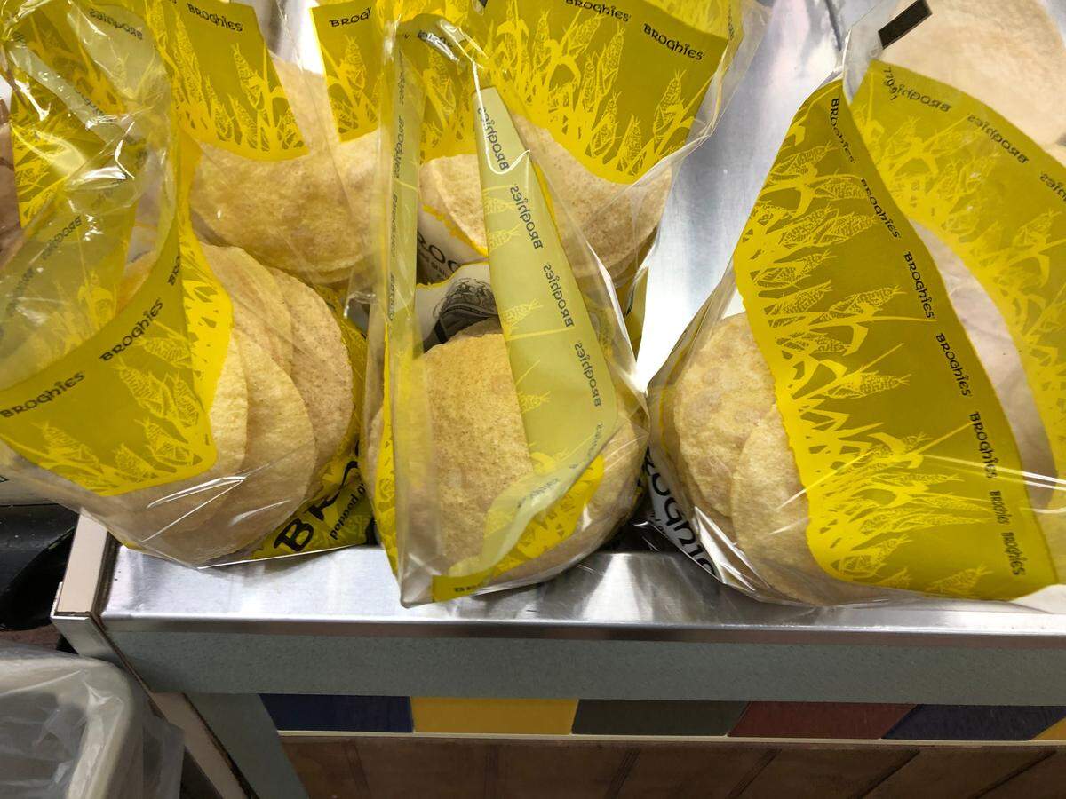 2/10/2021-- Broghies are bagged and then placed in boxes for shipment around the country at Mixon Fruit Farms. Mixon is now the U.S. distributor for the popped grain wafers.