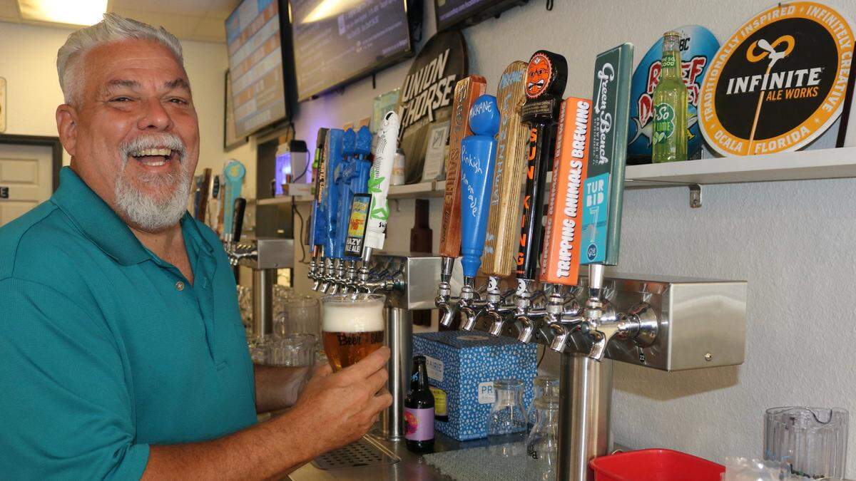 General manager Bob Raymond, shown Dec. 12, 2022, draws a beer at BeerSauce Shop, 419 Cortez Road W., Bradenton. The business opened on Thanksgiving and will host a grand opening celebration noon- 7 p.m. Dec. 30.