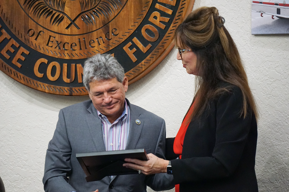05/28/21--Superintendent Cynthia Saunders presents Scott Hopes with a service award at the school board’s May 28 meeting.