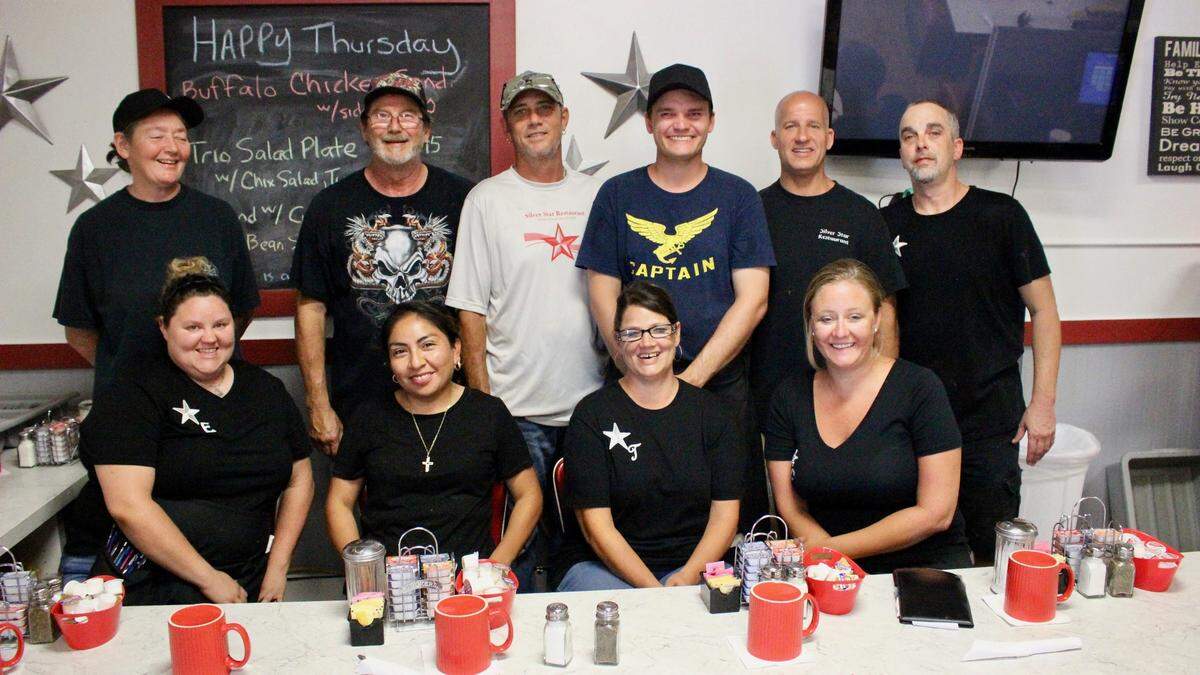 Preparing and putting food on the table for guests at Silver Star East are, front, left, Elise Bevier, Claudia Guadalupe, Toni Sapp, Casey Thompson, back, left, Annie Roche, Walt Rowan, Greg Sapp, Russell Schilling, Mike Krone, and Bill Sherry.