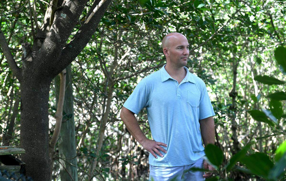 06/22/21—Lee White stands in a mangrove thicket behind his home on Terra Ceia where he’d like to protect the nature for his family and others to enjoy. The State of Florida wants to preserve 2,300 acres of environmentally sensitive Terra Ceia mangrove swamps and flatwoods.