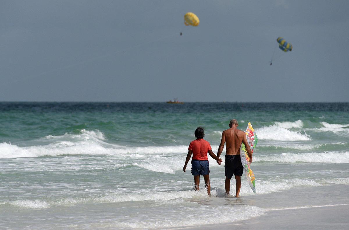 Visitors enjoy the waters of Coquina Beach on the southern end of Anna Maria Island.
