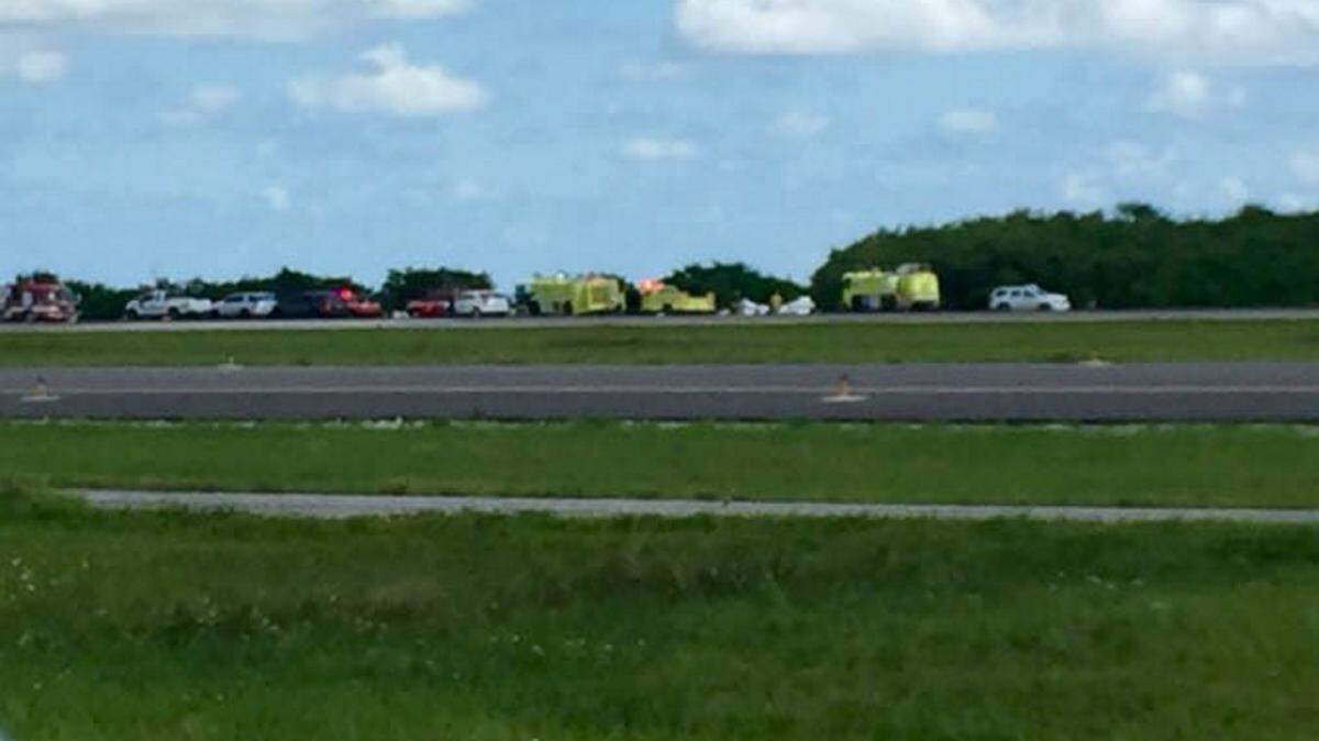 Emergency vehicles respond to the scene of a small plane crash at St. Pete-Clearwater International Airport on Wednesday. The plane's lone occupant was killed. 
 BAY NEWS 9 staff