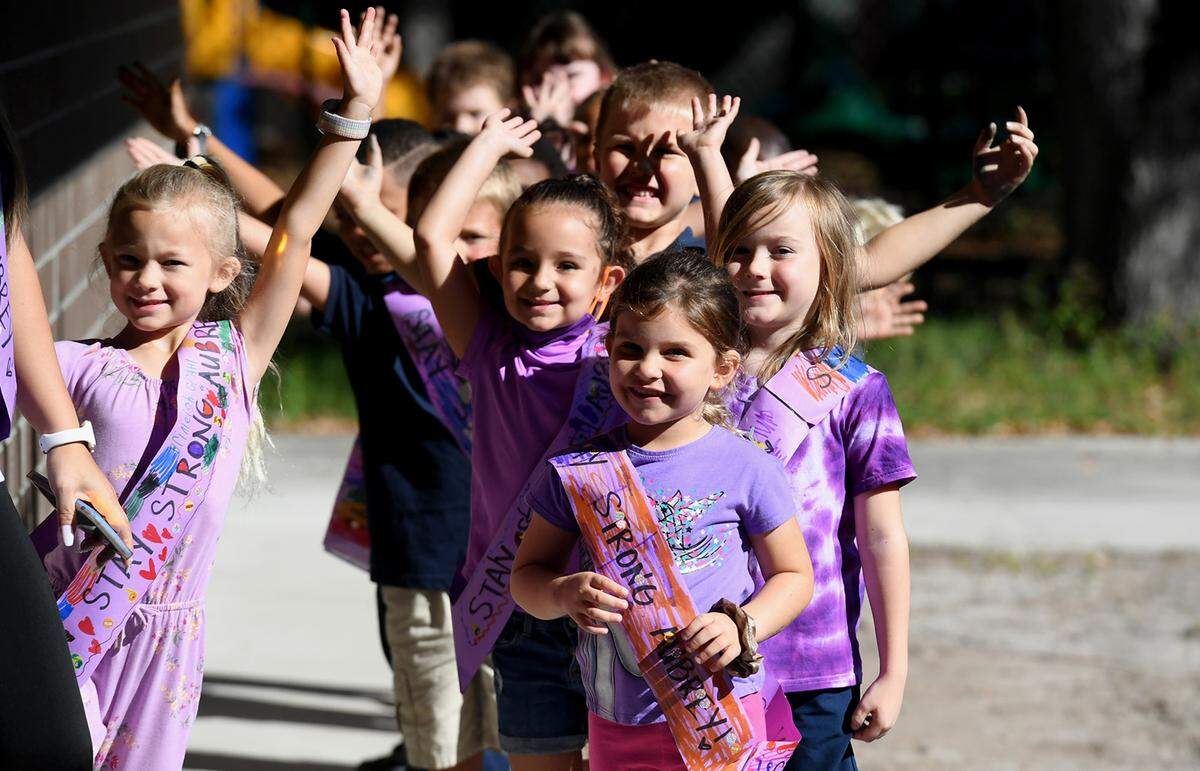 10/15/21—Students from Sea Breeze Elementary School dressed in purple for “Aubrey Day,” raising money and awareness for a student diagnosed with a rare cancer.