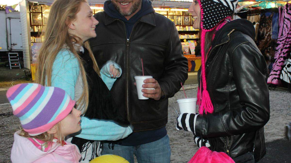 The only comfortable fairgoers Sunday evening were folks bundled up against the cold, like, from left, Kamry Newman, Journey Bacon, Danny Newman, and Tabitha Bacon of Bradenton. Photos by JAMES A. JONES JR./Bradenton Herald