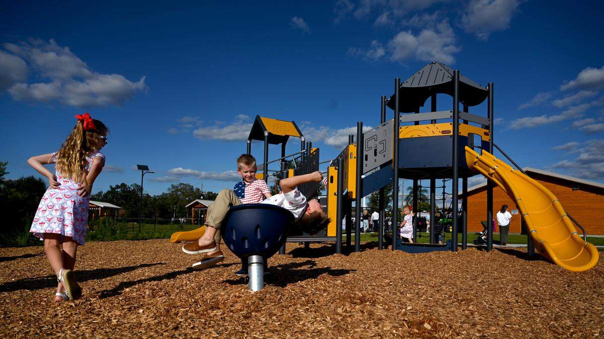 Children play before Florida Gov. Ron DeSantis made an appearance in Manatee County for the opening of a park named in his honor on Wednesday, Oct. 18, 2023.