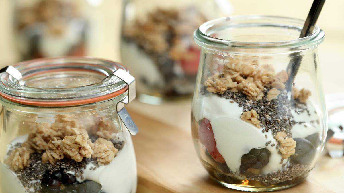 Yogurt parfaits can be adapted endlessly. These layer blueberries, blackberries and raspberries, granola and chia seeds. TNS PHOTOS