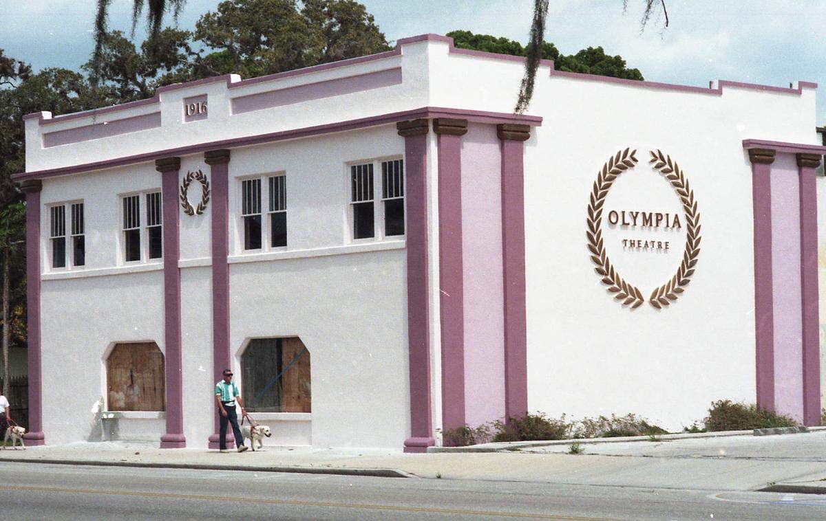 Exterior of the 1916 Olympia Theatre, 512 10th Ave W, Palmetto. The theatre was purported to be the first movie theater on the West coast of Florida. It first closed in 1956. It then housed various restaurants until 2009 when it was restored as the Olympia Performing Arts Center. In 2011 the performing arts center closed. As of 2020, the building is almost unrecognizable, as it is vacant and covered in ivy.