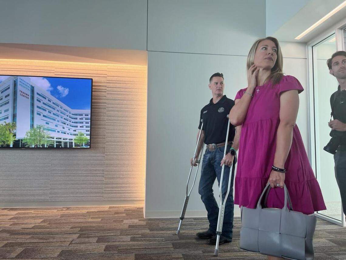 Congressman Greg Steube, on crutches, enters the Brian D. Jellison Cancer Institute Oncology Tower at Sarasota Memorial Hospital with his wife on February 16, 2023.