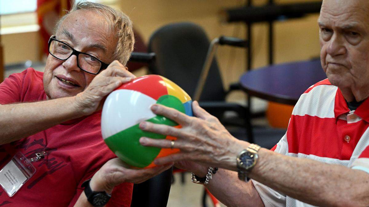 Seniors at the Daybreak Adult Day Center 10920 SR 70 E, Bradenton enjoy games of hot potato and table balloon tennis on June 26, 2024.