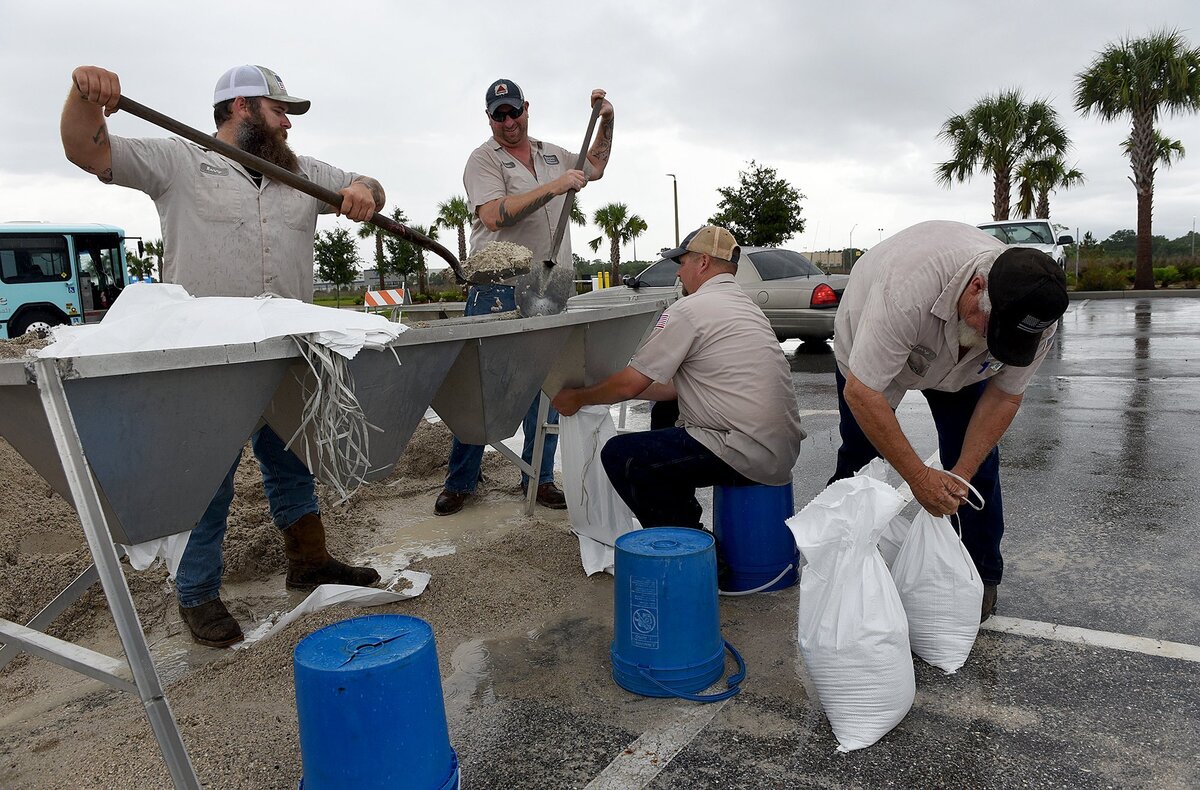 Manatee County Public Works employees fill sandbags at the transit fleet authority Friday afternoon ahead of subtropical storm Alberto.