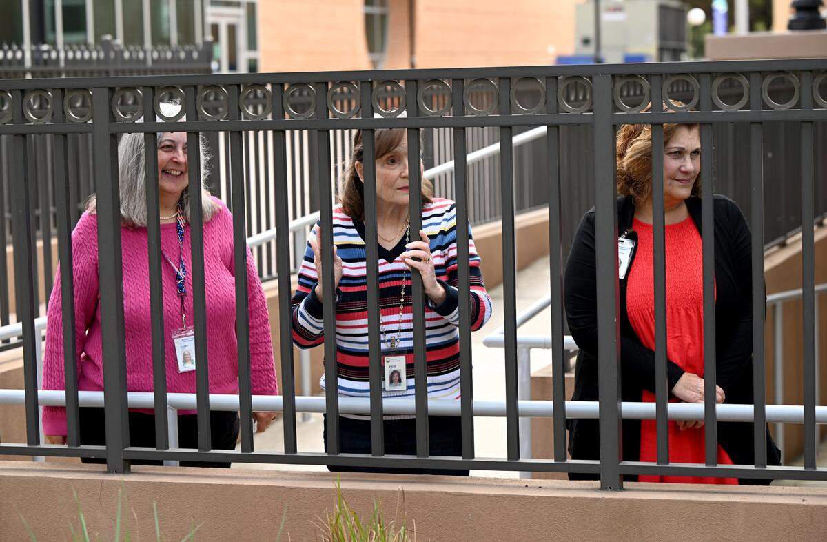 Employees of the courthouse watch the Fifth Annual Valentine’s Day Group Wedding in the courtyard of the Manatee County Historical Courthouse on Feb 14, 2025.