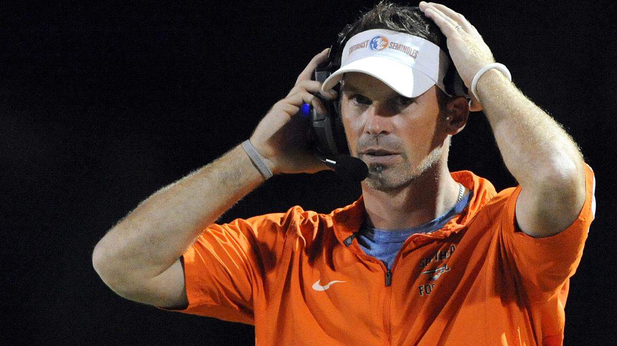 Southeast head coach John Warren on the sidelines during their game Friday night against Booker in Sarasota. 
 TIFFANY TOMPKINS-CONDIE/Bradenton Herald