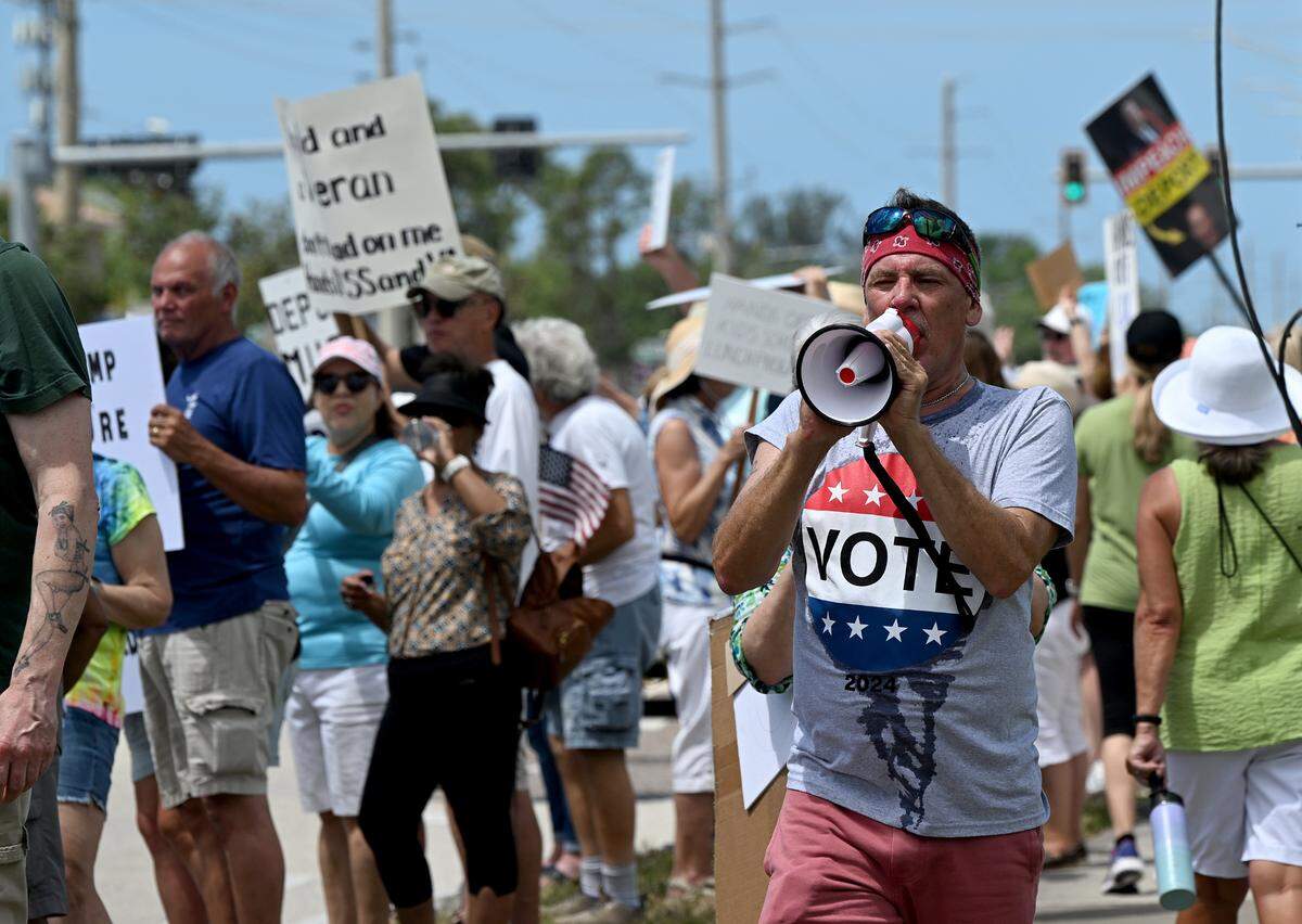 Hundreds of protestors gathered Saturday, April 5, 2025, on Cortez Road West in one of the many national “Hands off” protests against President Donald Trump’s policies.