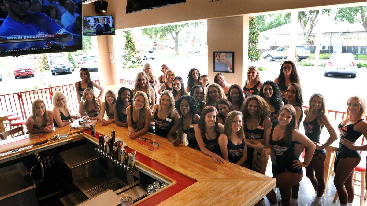 Waitresses take a break from their training to pose at Ker's WingHouse, 2015 60th Ave. E. in Ellenton. The restaurant opens Monday with sports celebrities, autograph signings and other special events. GRANT JEFFERIES/Bradenton Herald