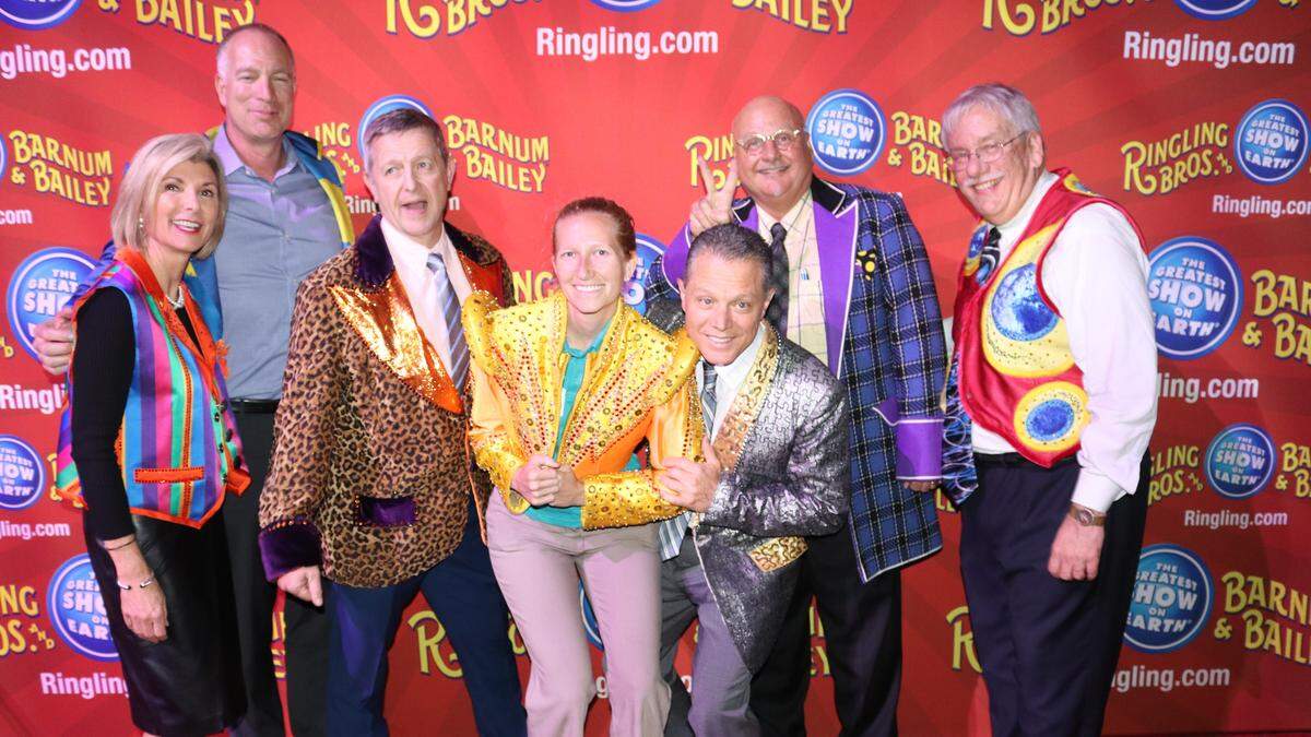 Among those trying on some of the Feld Entertainment wardrobe were, from left, Sharon Hillstrom, Chris Ciaccio, Mark Evans, Amber Green, Dom DiMaio, Tim Novak, and Mark Barnebey. The event was part of networking before the Bradenton Area Economic Development Corporation annual update.