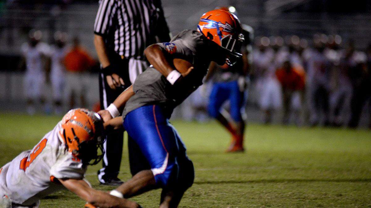The Seminoles answer the previous Manta Ray scoring drive by scoring their own by a 10 yard run by running back Kevin Johnson (15) at the 6:43 mark of the third quarter. The Lemon Bay Manta Rays traveled to Bradenton to play the Southeast Seminoles in football action on Friday evening, October 16, 2015. 
 DAVID W DOONAN/Special To The Herald