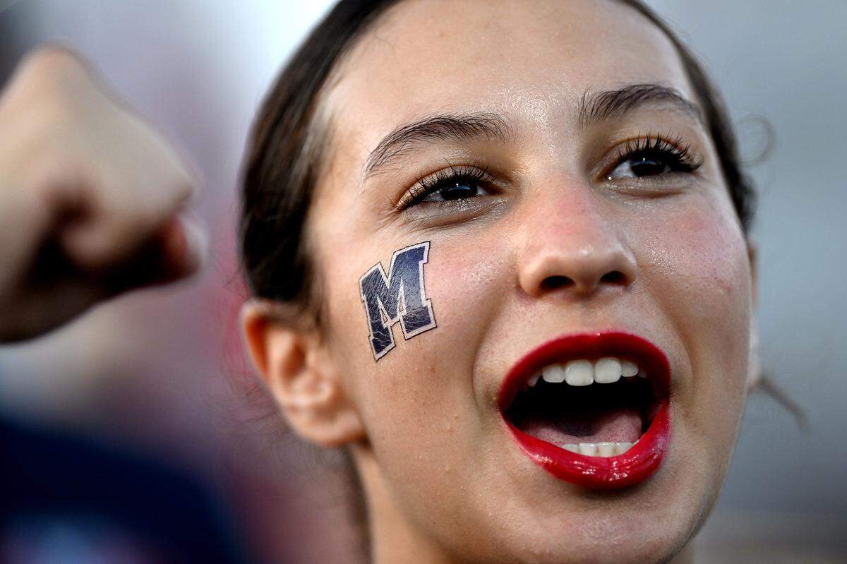A dancer performs with the Marching Canes Friday, Sept. 15, 2023 at Hawkins Stadium.