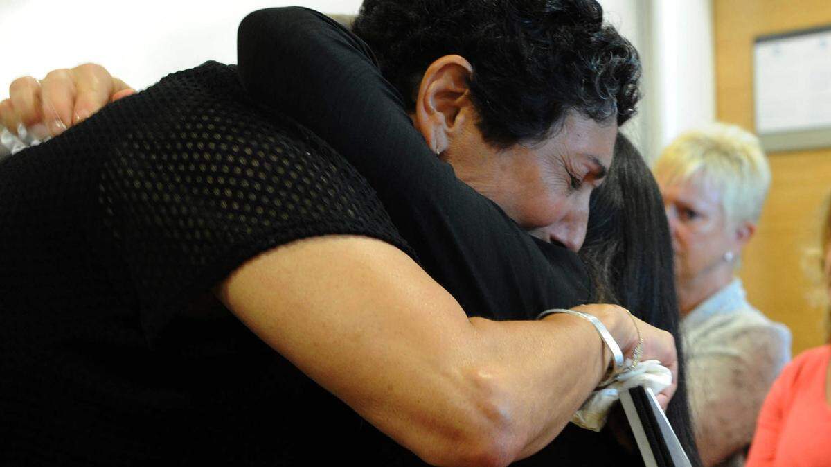 Margarete Costanzo, the mother of Jessica Costanzo, hugs Margharita Komyati, the mother of Gabriella "Gigi" Longpre, after Costanzo spoke at the sentencing of Emerson Herrera on Friday. Herrera pleaded no contest to two counts of first-degree vehicular homicide and grand theft auto for the Nov. 20, 2014, crash that killed their daughters. 
 GRANT JEFFERIES/Bradenton Herald