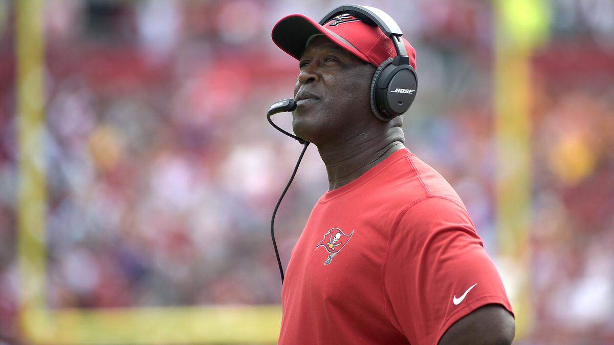In this photo taken Oct. 4, 2015, Tampa Bay Buccaneers head coach Lovie Smith watches from the sideline during the first half of an NFL football game against the Carolina Panthers in Tampa, Fla. In Jameis Winston, the Tampa Bay Buccaneers figure they've found their starting quarterback for this season _ and many seasons to come. Their game Sunday comes against the Washington Redskins, a team that really has no idea what it's got at QB. (AP Photo/Phelan M. Ebenhack)