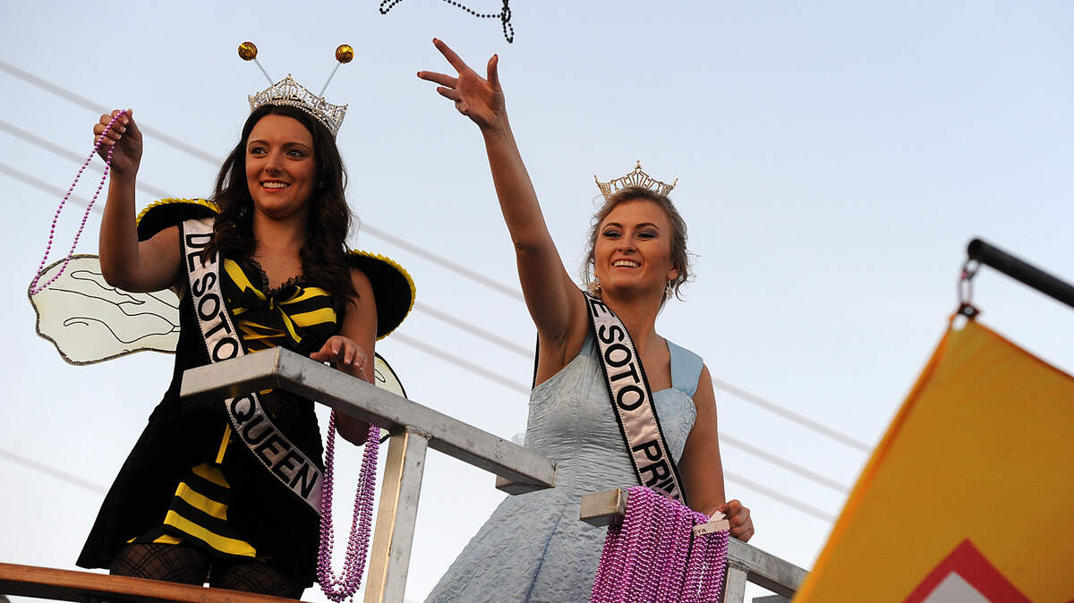 The DeSoto Queen and Princess throw beads in the Hardball Halloween Parade in Palmetto on Saturday night.TIFFANY TOMPKINS-CONDIE/Bradenton Herald