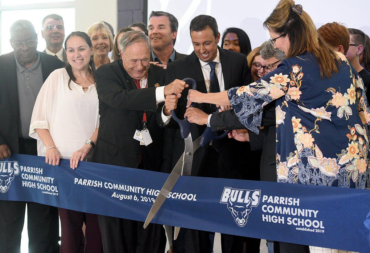 Manatee County School Board members joined Principal Craig Little for the ribbon cutting at the new Parrish Community High School.